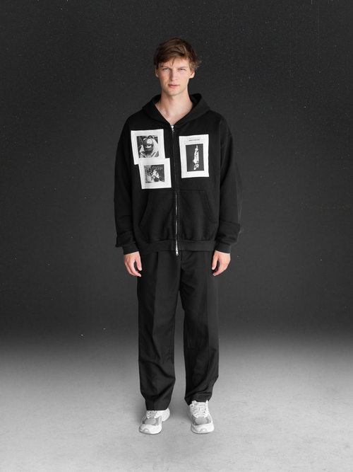 Wearing a Angels in Mahines black zip-up with printed Formula 1 images